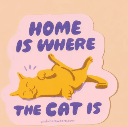 Personalize your accessories with the adorable Home Is Where the Cat Is sticker by And Here We Are, featuring a playful orange cat illustration and purple bubble text.