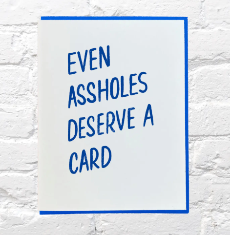 Close-up of the tactile, pressed ink on a Bench Pressed humor card with a coordinating kraft envelope.