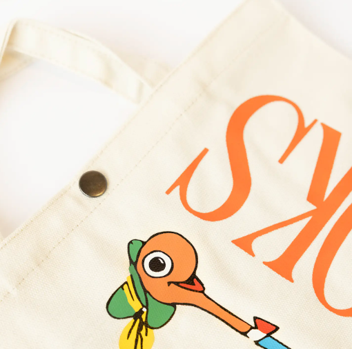 A close-up view highlights the superior screen printing and durable canvas of the Lowly Worm Books Tote.