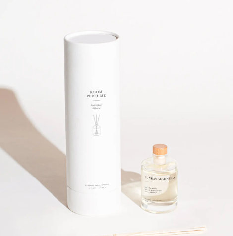 Upgrade your home fragrance collection with an artisan-poured scented oil bottle that arrives in a premium, textured white gift cylinder.