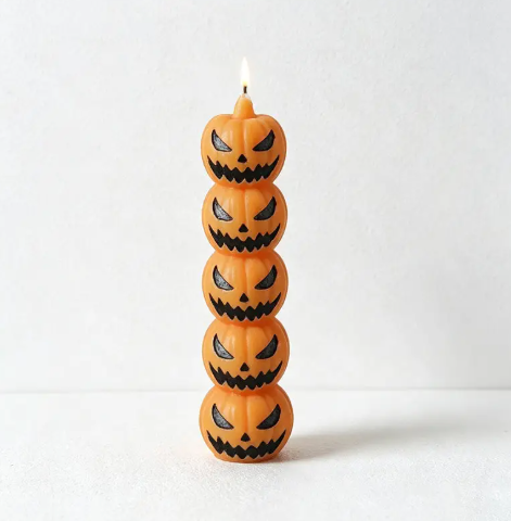 Add classic seasonal charm with the Stacked Pumpkin Halloween Sculpted Candle by CouldNook, showcasing vibrant orange jack-o'-lantern faces.