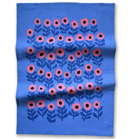 View the full design of the Pink Poppy Tea Towel by Badger & Burke, highlighting vibrant pink floral motifs on a rich blue backdrop.