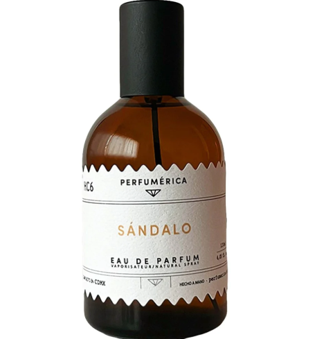 A bottle of Sandalo Eau de Parfum by Perfumérica placed beside its sleek black and gold branded presentation box.