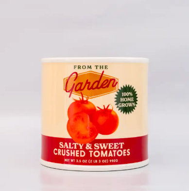 Looking for a fun conversation starter? This realistic Ban.do tomato can ceramic vase is a quirky and charming addition to any tabletop or shelf. Grab yours now!
