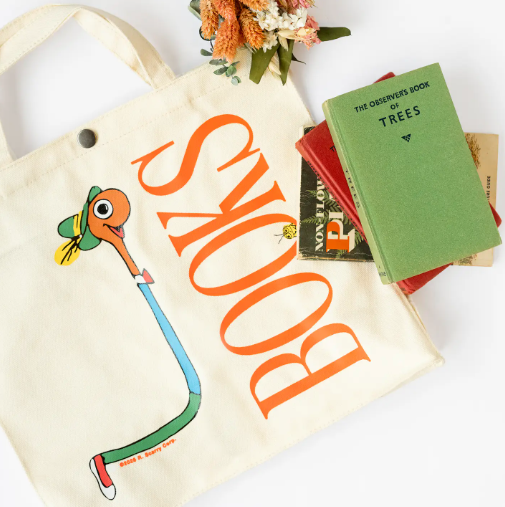 The perfect blend of nostalgia & utility, showcasing the Lowly Worm Books Tote's ample size and delightful design.