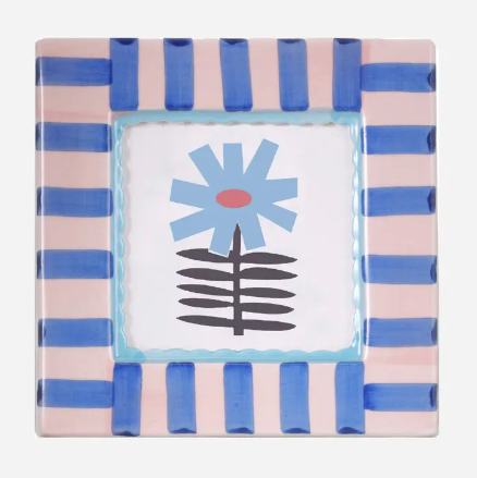 A square hand-painted ceramic photo frame by ChagoArt featuring bold blue and white stripes.