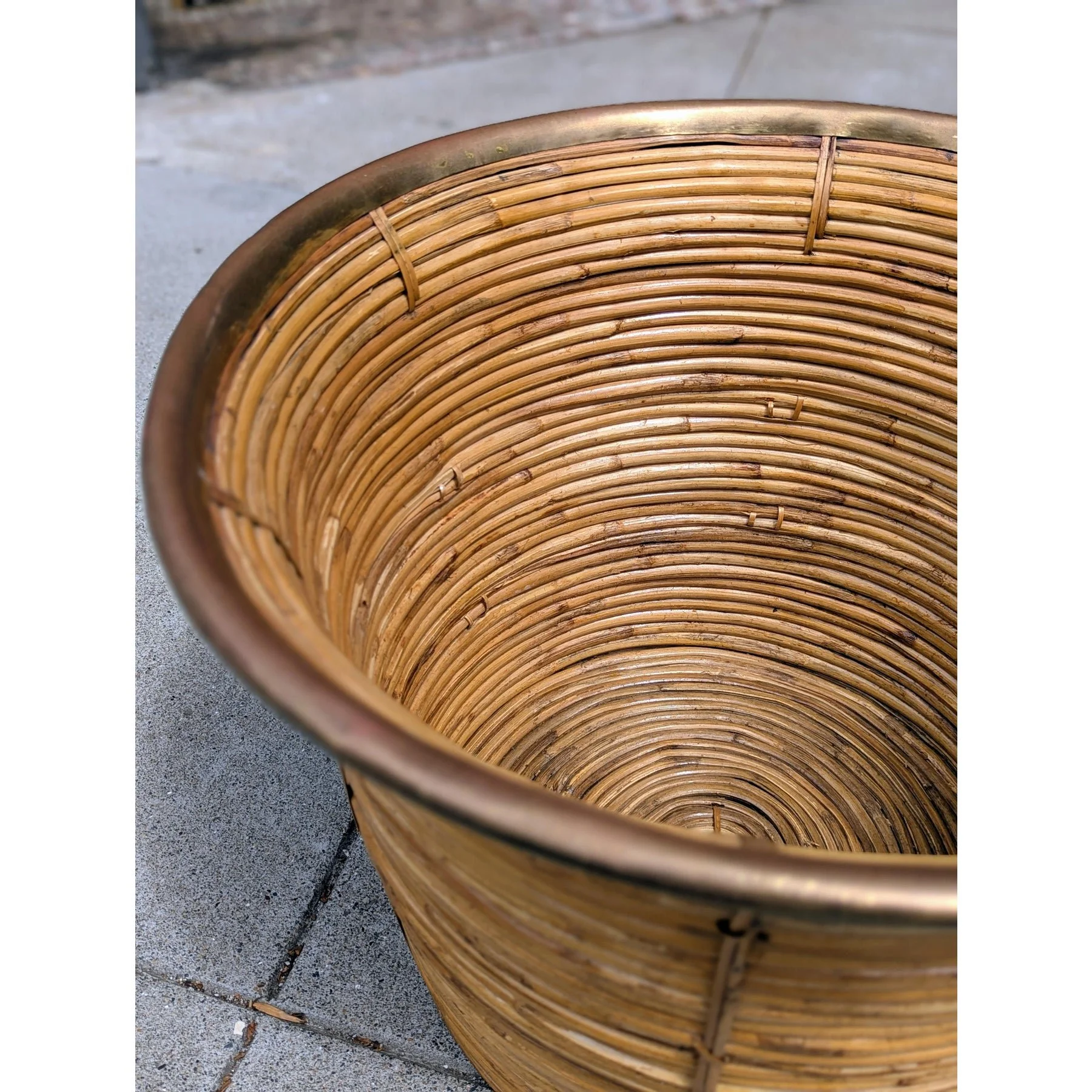 Vintage large rattan and brass planter, angled view of interior and brass rim