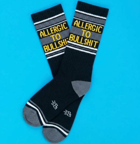 Flash a bit of sassy humor with the Allergic To Bullshit Gym Crew Socks by Gumball Poodle, featuring a bold black and grey ribbed design knit with bright yellow lettering.