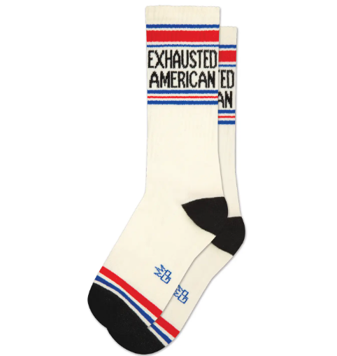 "Exhausted American" Gym Crew Socks by Gumball Poodle, featuring Natural Cotton with Royal Blue, Red, and Black accents.