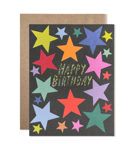 A whimsical birthday card featuring a night sky illustration with hand-drawn stars and shimmering glitter foil accents.
