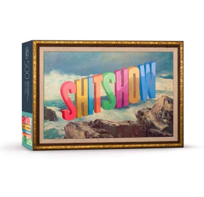 A 500-piece artist series puzzle by Fred & Friends featuring Shitshow, vibrant artwork and thick ribbon-cut pieces.
