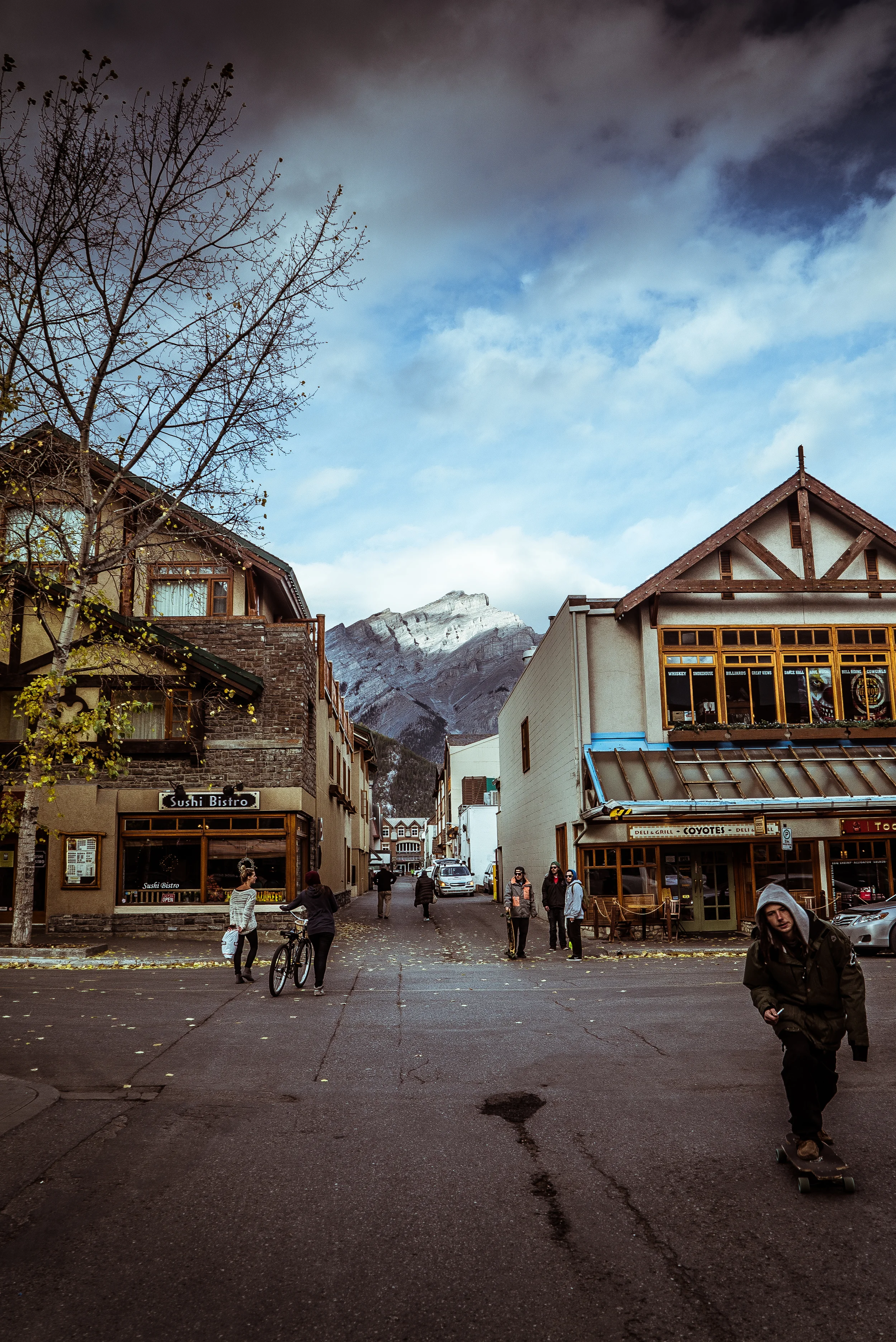 In a back alley in Banff. With Cascade Mountain
