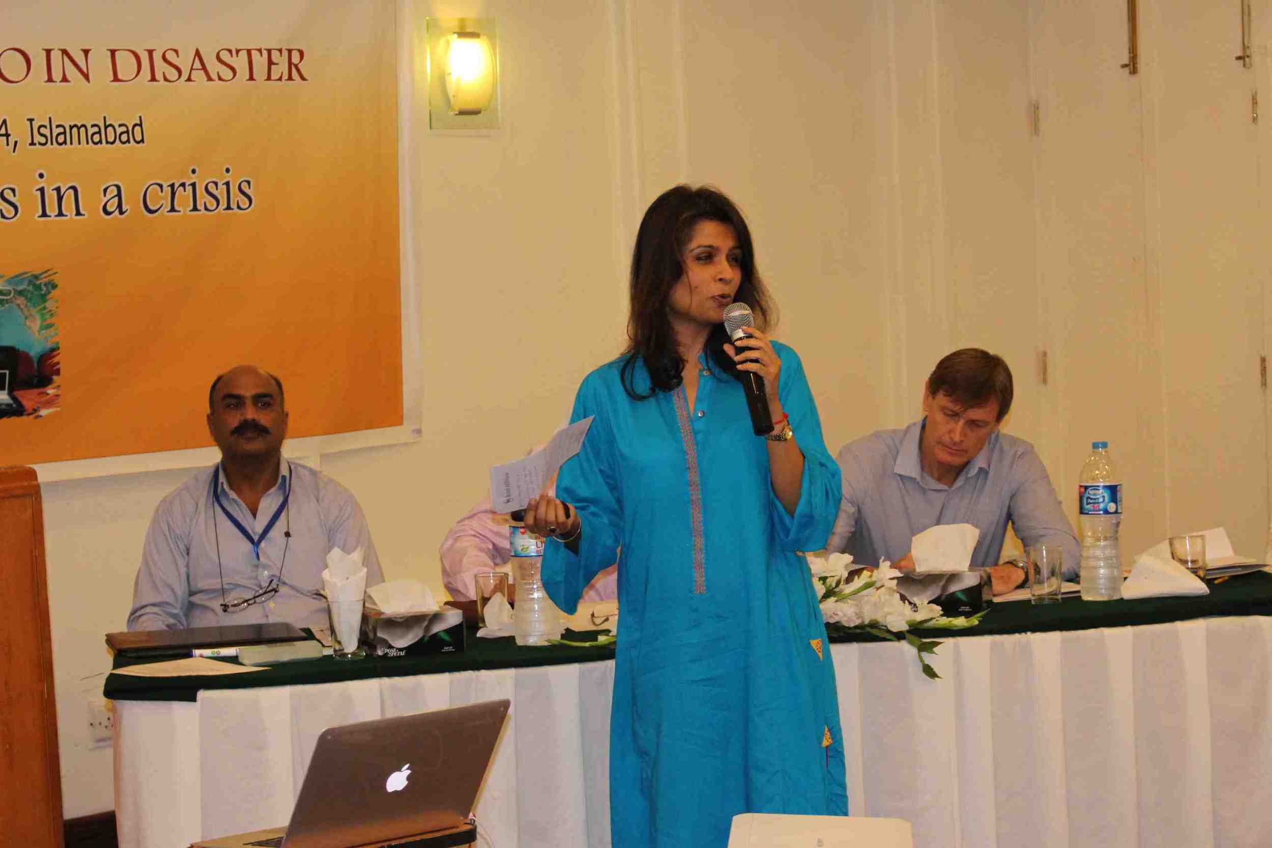 IOM's Naima Saeed speaking at the First Response Radio inaugural event in Islamabad