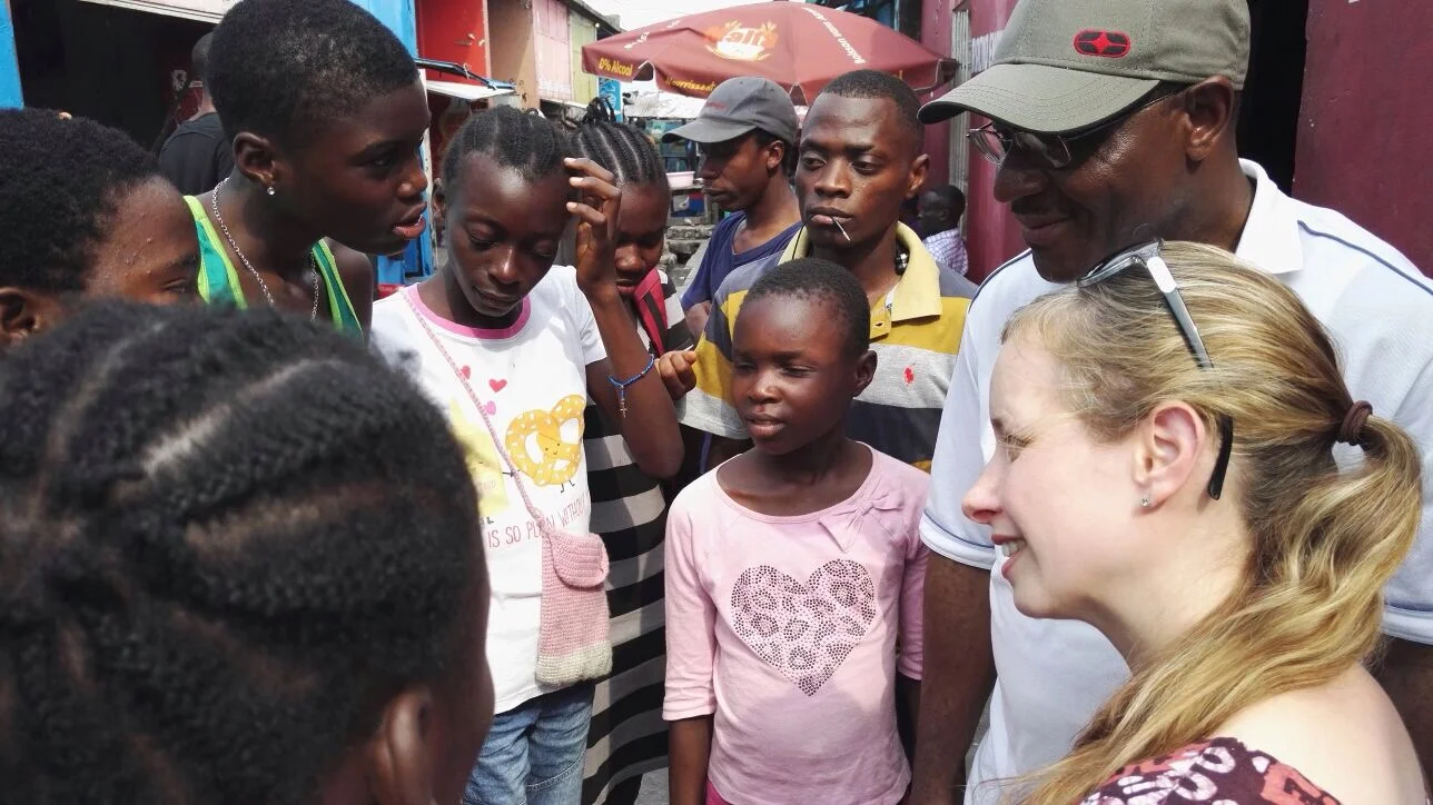 Photo Credit: Feba Stephanie chatting with street-living children in Kinshasa