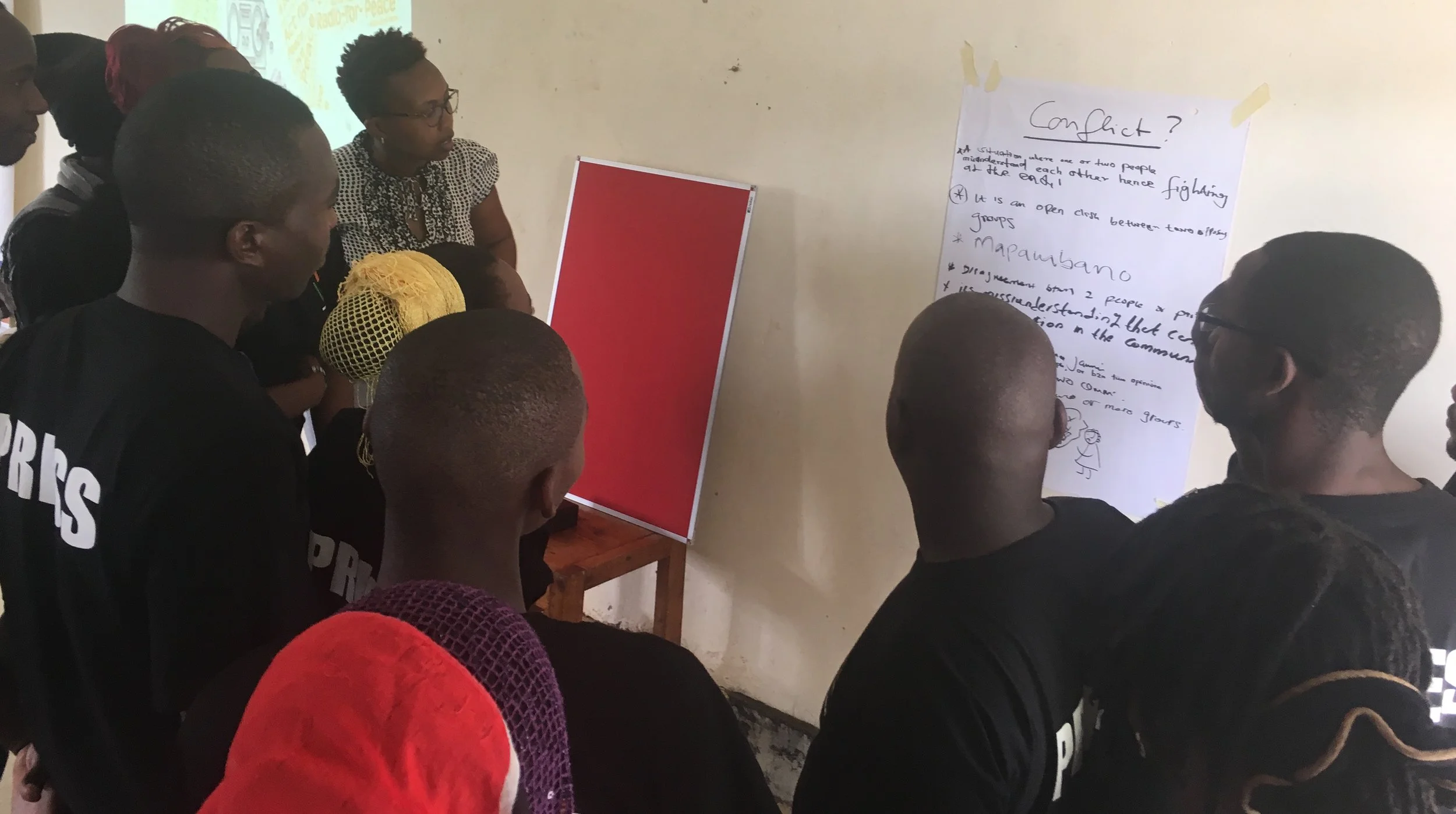 Volunteer journalists at Amani FM receiving training in peacebuilding and conflict transformation
