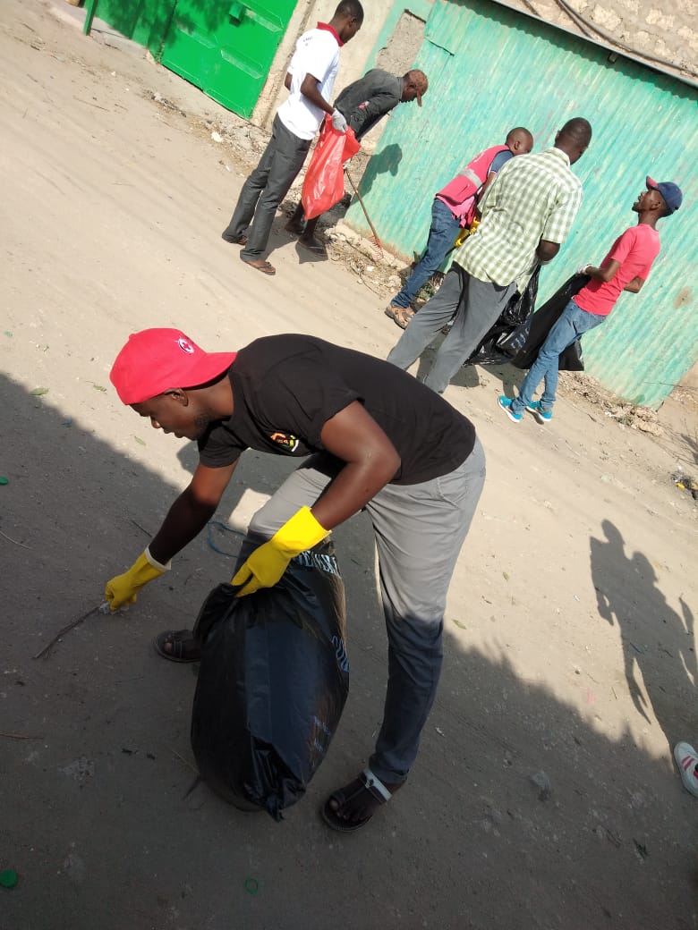 Amani FM presenters, Red Cross workers and youth join together to clean up their town in Tana River County