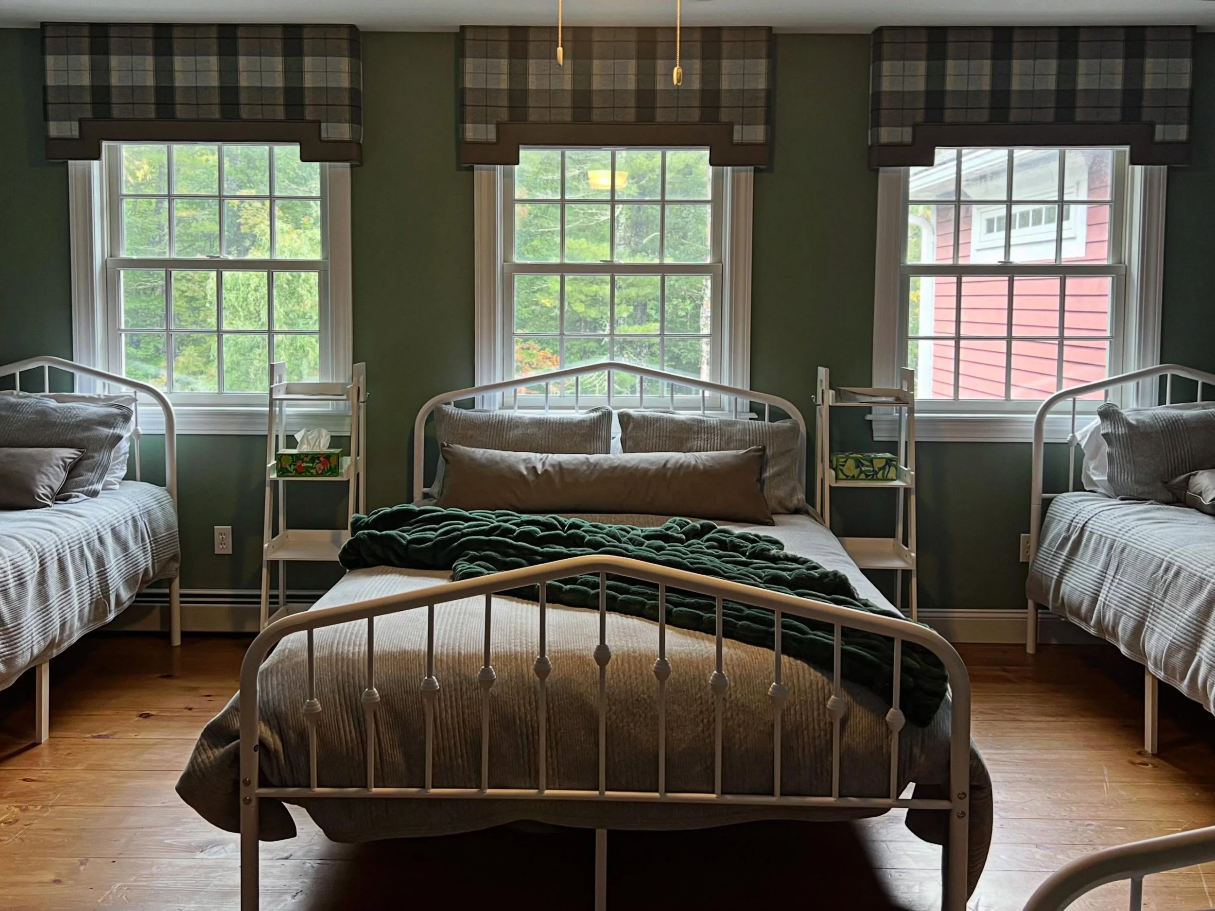 This room showcases shaped cornices in a Stroheim wool plaid, with leather contrast banding, matching leather lumbar pillows, and a Sanderson wallpaper. We absolutely love how this room turned out! 
.
.
.
#customdesign #fabrics #interiordesign #south