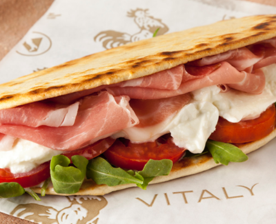 A piadina flatbread sandwich at Vitaly. Freshly baked piadina, imported prosciutto, buffalo mozzarella, fresh lettuce and Roma tomatoes make for a splendid lunch. (Source: Vitaly)