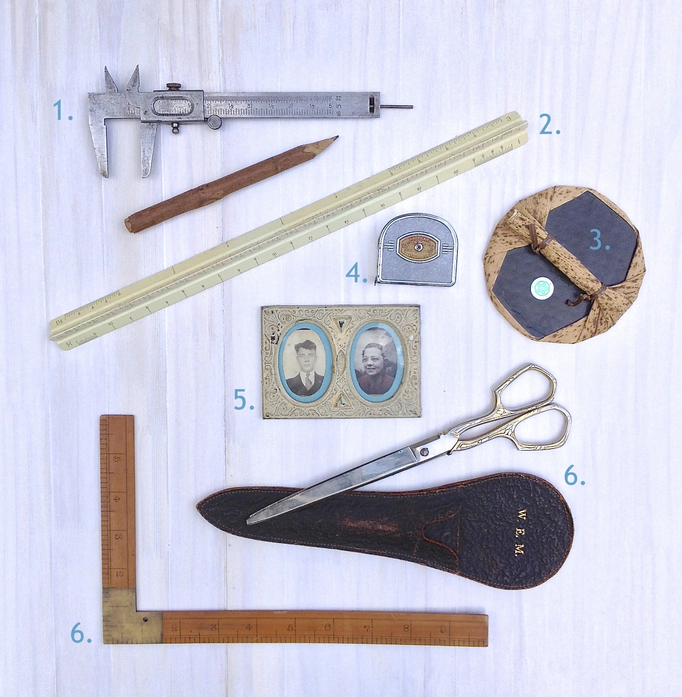 I create my pocket squares using a variety of tools, some old and some new. These are a few of my favorites, some of which have been passed down in my family for over 100 years. Often, when I am drafting designs, I think about the hands that held them years ago, and it makes me feel connected to the past and to my relatives. 1. Globemaster Vernier Caliper: Used by my maternal grandfather, Kenneth Ernest Stephens, in his woodworking projects for the boats he restored in his lifetime. I now use the calipers to register blocks, making sure lines and sides are square and equidistant. 2. Staedtler Architect Ruler: Another one of Ken's tools, used for everything from creating signage to charting waters, now it drafts maquettes of my designs. 3. Yasutomo Bamboo Baren: This baren, made of layered bamboo, is used to pull proofs of my carved and inked blocks. It's an ancient tool, used by Japanese and Chinese printmakers as early as 700 AD. 4. American Electric Supply Co. Measuring Tape: Passed down from Ken and my grandmother, Eileen Frances Maher Stephens, this treasure was manufactured in Hartford, CT, where they both spent their childhood, and also where my wife and I eloped eight years ago. 5. Family Photo: My great-grandfather Franklyn Sydney Maher, made this for his mother, Mary Benway Maher, and it reminds me of all the artists in my family. 6. Sterling Winstead Scissors: Mary Benway Maher inherited this set from her mother-in-law upon her marriage to my great-great grandfather, Reginald Tallman Maher. 7. Brass and Cherry Framing Square: Used by Franklyn, an avid photographer, world traveller, and amateur genealogist, this square is a reminder of how many people came before me, how I am like a fraction of an inch on a ruler with no end.