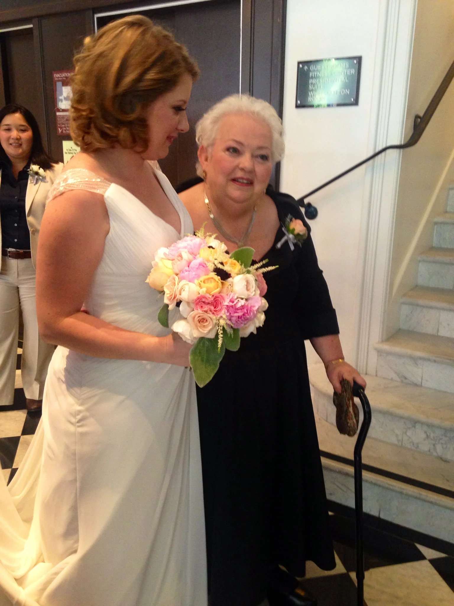 The bride makes the bouquet even more beautiful.