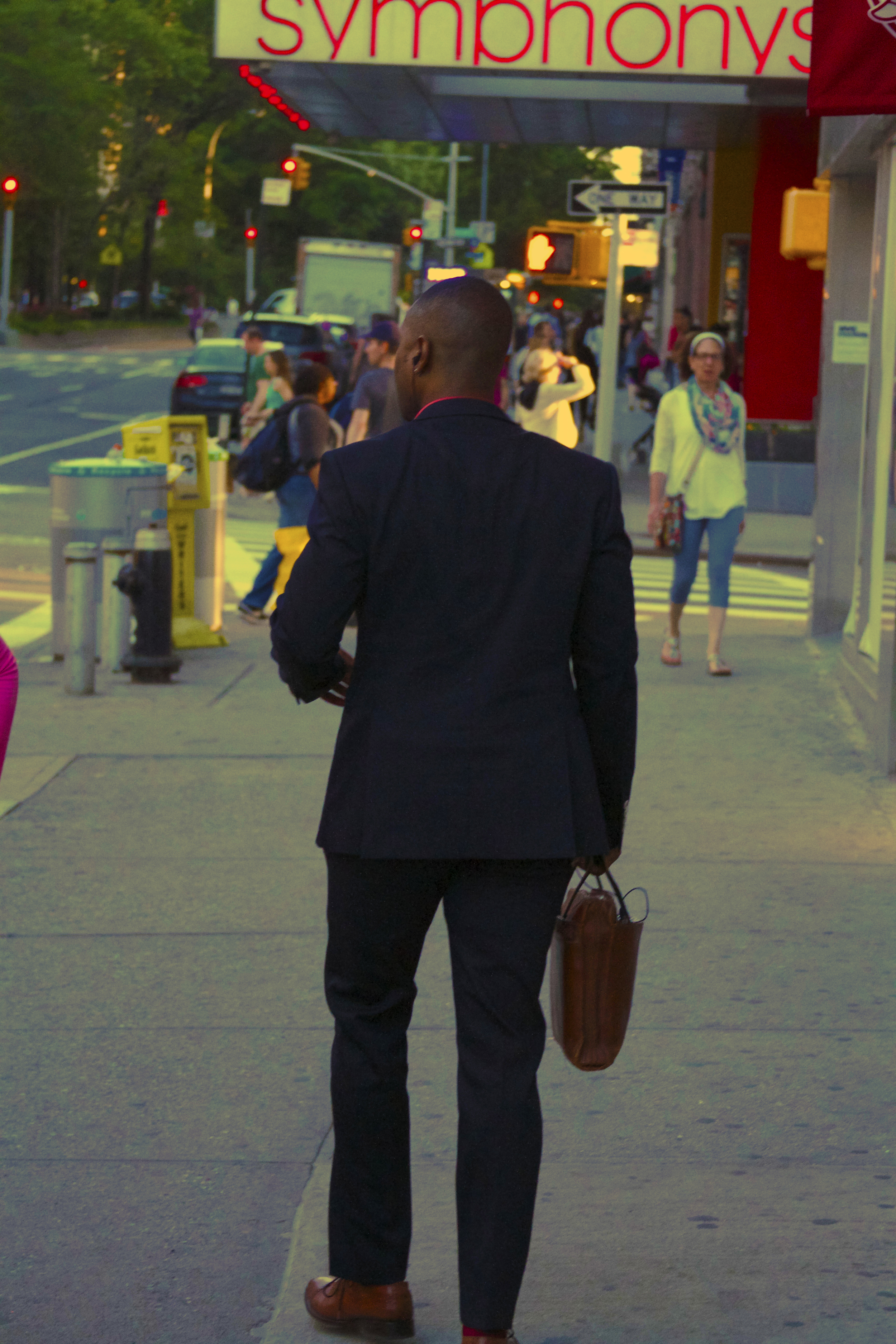 The vertical orientation of the photo allowed me to capture the subject's entire body and the details of his attire and presentation. Also present is a figure ground relationships between the subject and the ground. The attached shadow on the subject is not as transparent but there is a slow falloff happening. 