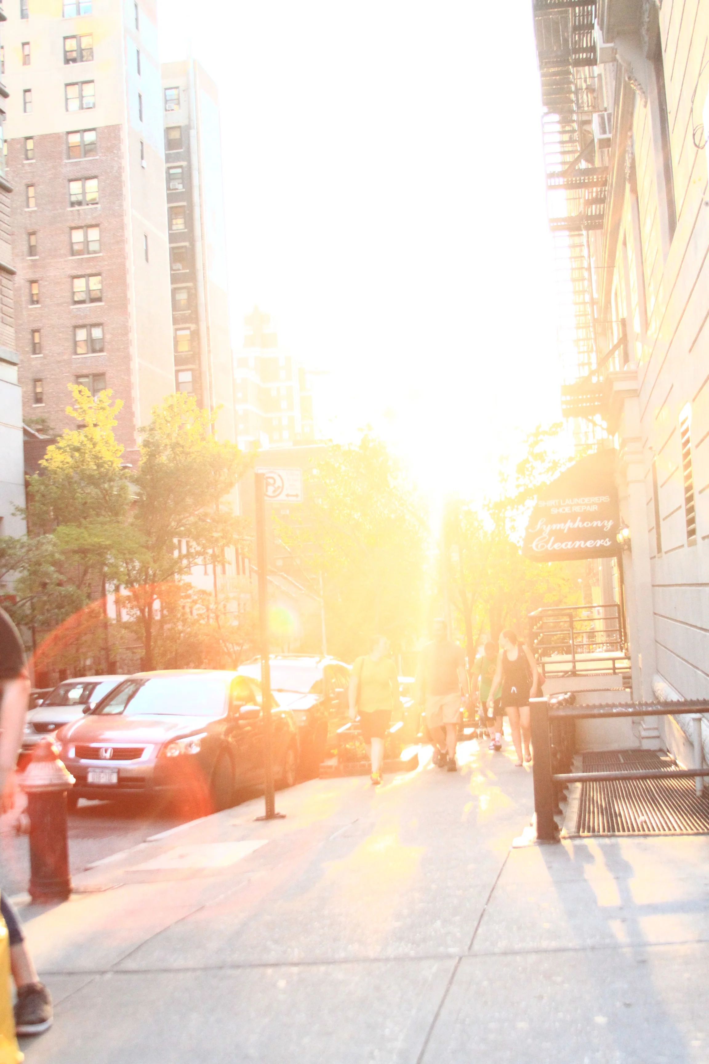 I shot this one using the natural light to create a silhouette and center pull with the subjects walking towards me. This was an early morning capture, walking towards the train station, and I thought it was really cool shot.