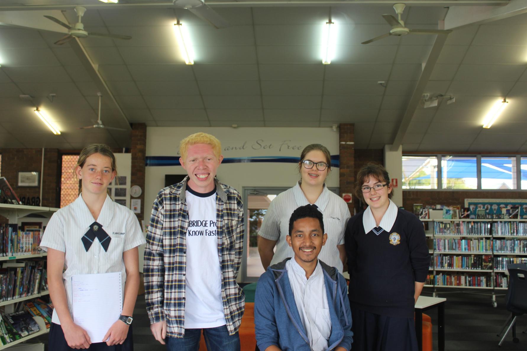 Taking picture at the library with the student of John’s Collage when they showing around of the school to us.