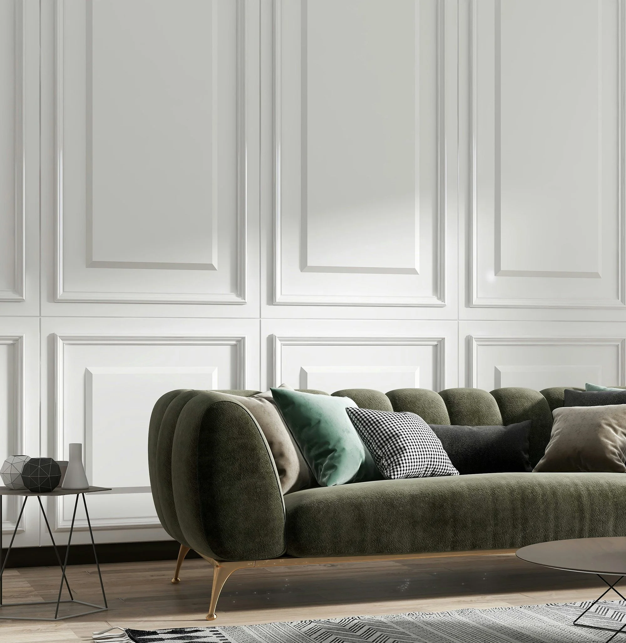 Living room with a green velvet sofa, decorative pillows, and a side table with geometric decor in front of white paneled walls.