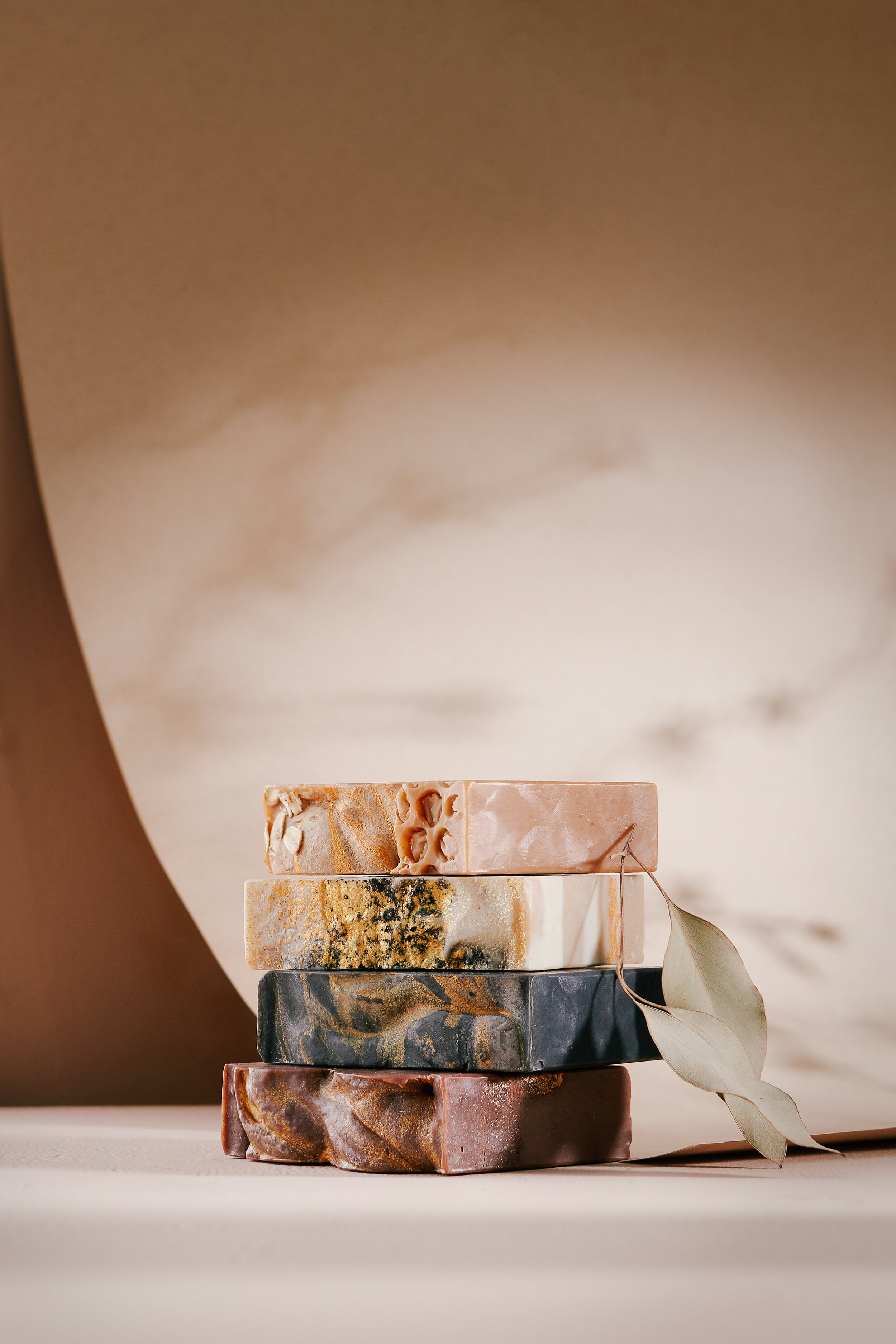 Sonture Beauty bath and body products photographed by Philadelphia photographer Tina Crespo, showcasing a stack of velvetty soaps.