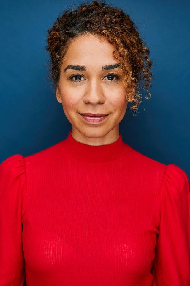 Amani Starnes Headshot Red Shirt Straight On.jpg
