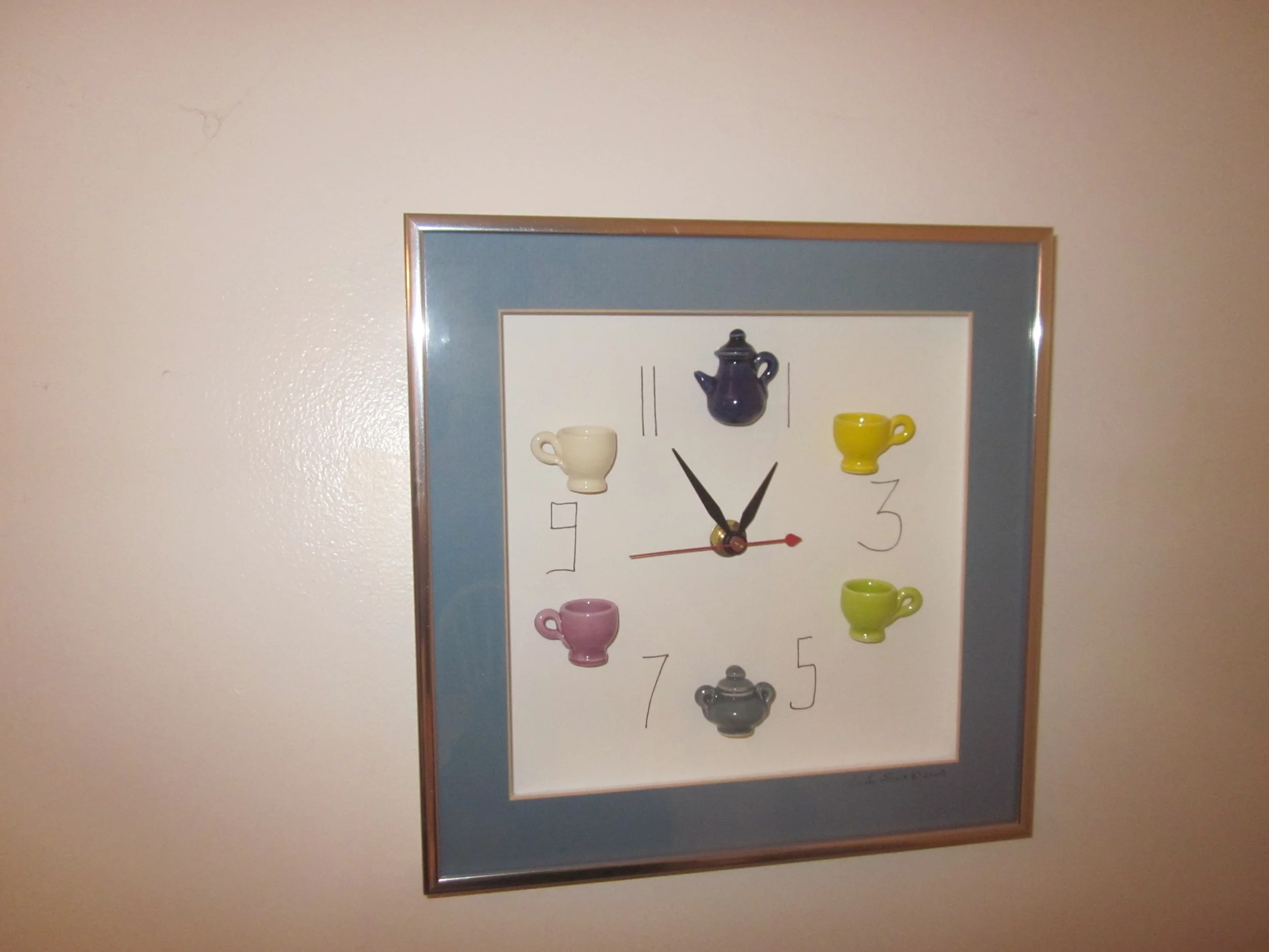 COFFEE TIME OUT This whimsical clock cheers me up every time I look at it on my kitchen wall. It features unique, miniature hand-made mugs, sugar bowl and cream pitcher, and was created by Carlos Silva of Centuries Claywork who "creates big moments with little pieces of art," according to the company's website.