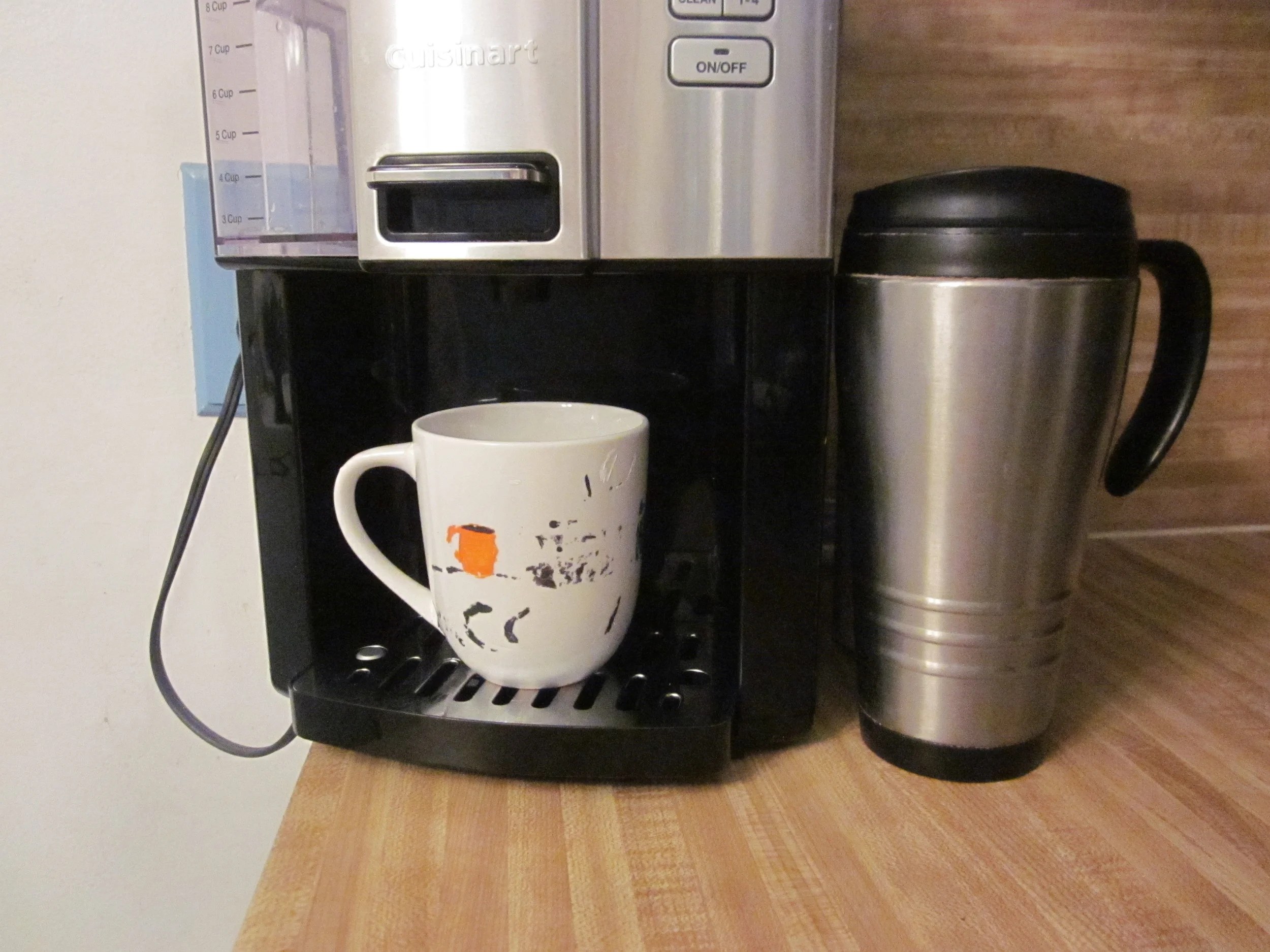 LIQUID HAPPINESS--JUST ADD COFFEE This well-loved, well-worn mug (left) was hand-painted by my nephew, Antone and said COFFEE + CUP = HAPPY. He knows his Tia Debbie. ONE FOR THE ROAD (right) Simple but effective.