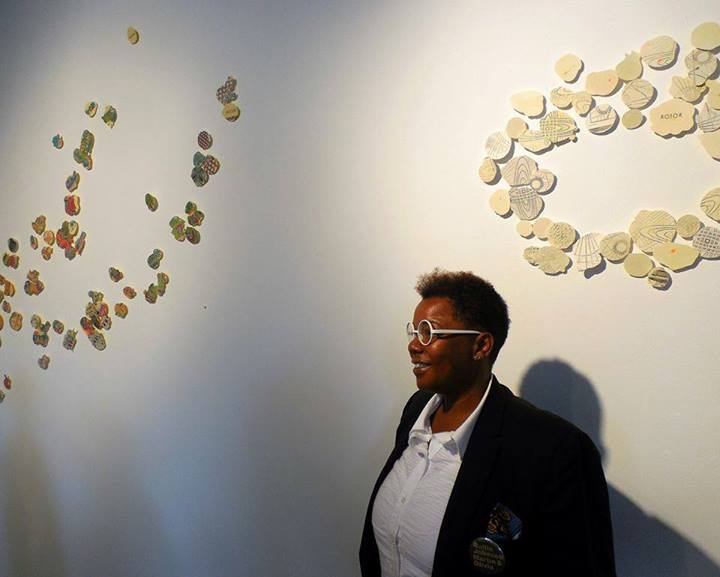 Olivia with her work (Photo taken by Sophie Asakura)