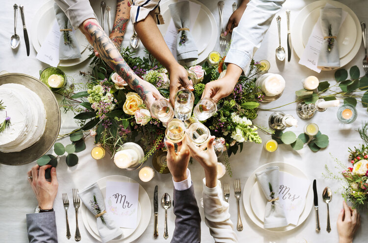 people-cling-wine-glasses-on-wedding-reception-PUEBCQW.jpg