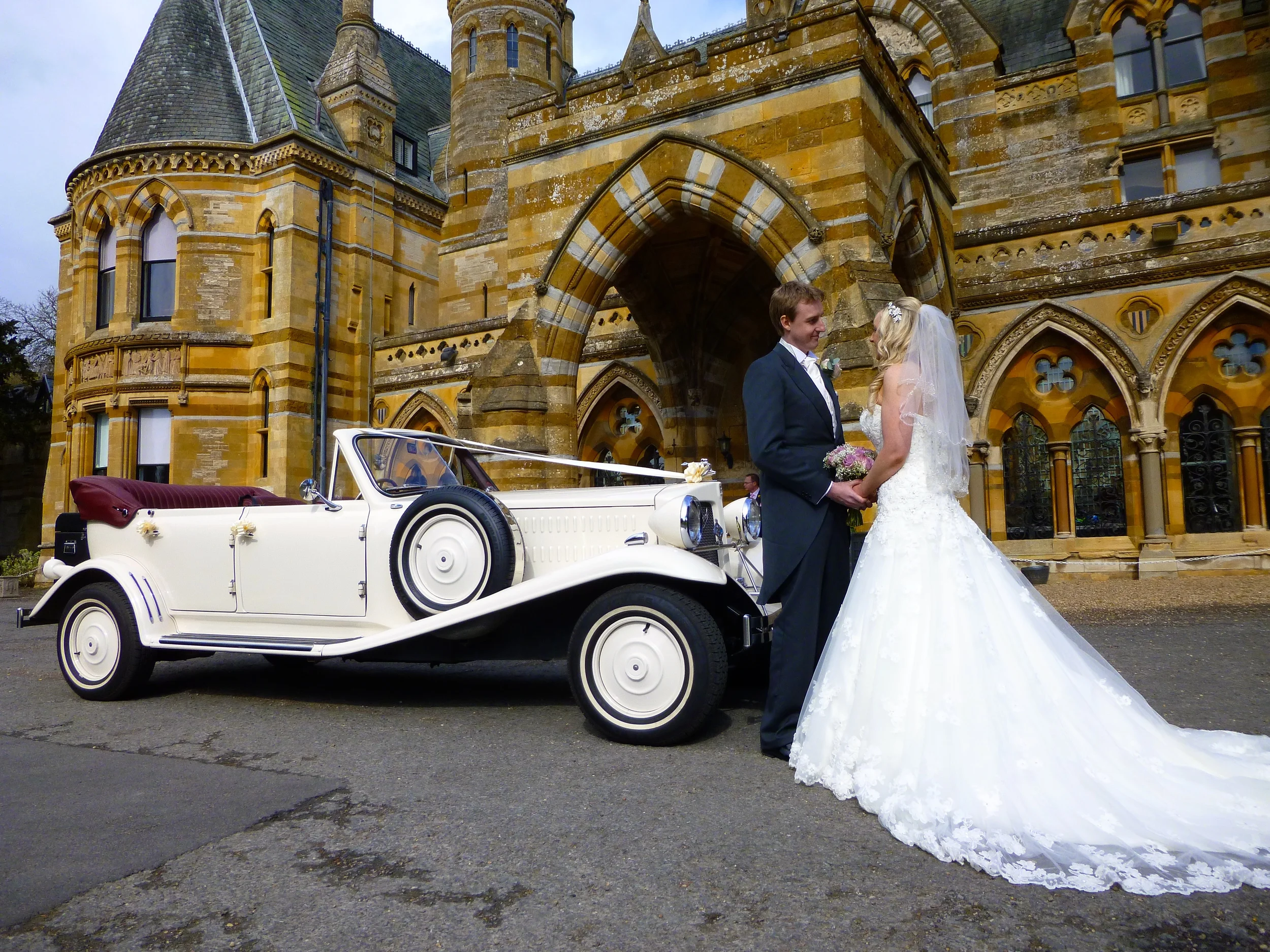 The Bride and Groom, James and Dianne pose for photographs at Ettington Park Hotel after the wedding ceremony at St. Mary's Church, Broughton Astley.