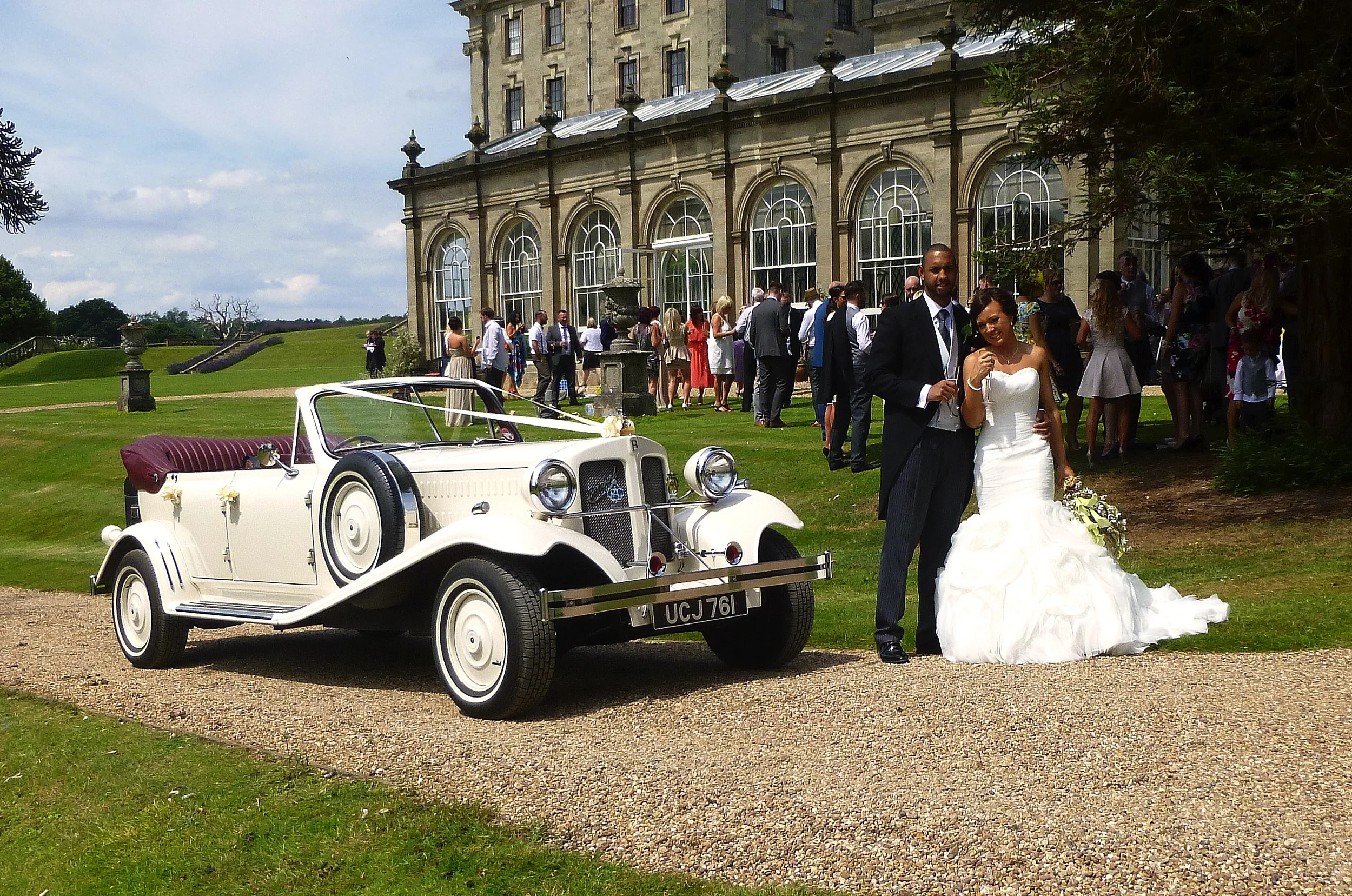 The Orangery at Stoneleigh Abbey. Bride and Groom plus guests, enjoying the hottest day of the year. So far!