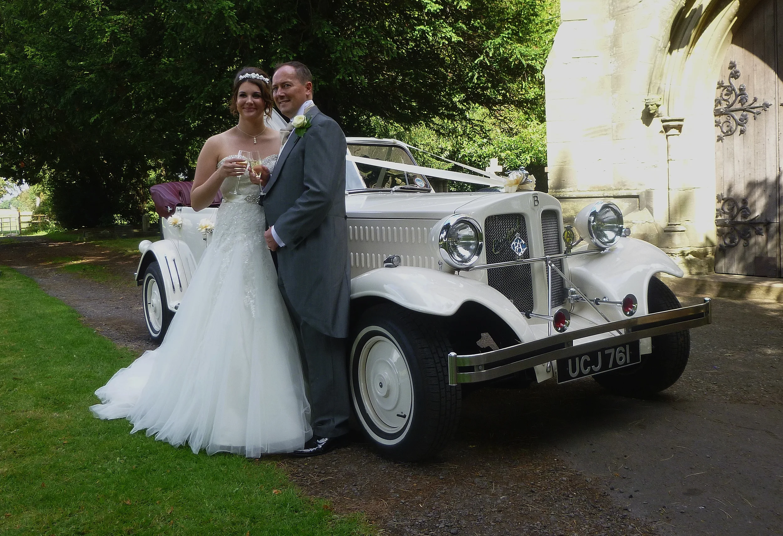 Danielle and Edward enjoying a toast following their wedding at St Jame's Church, Ansty, Coventry, Warwickshire. 