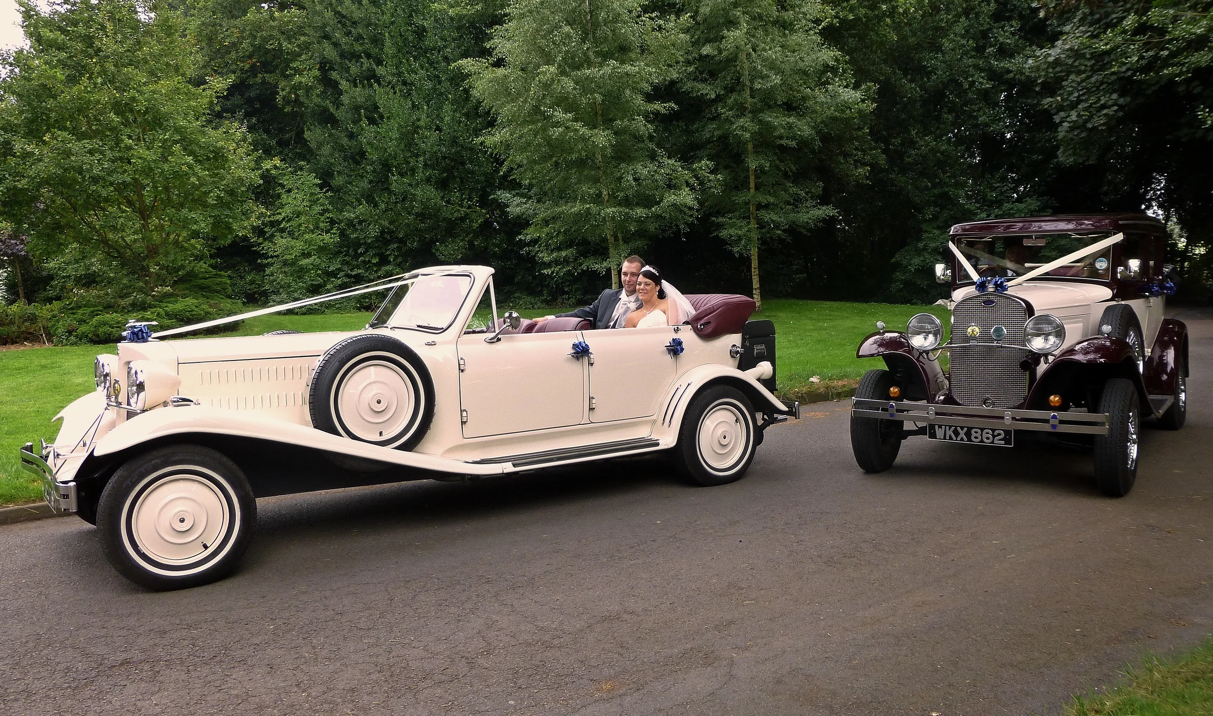 Arrival of the happy couple at the Royal Court Hotel, Coventry. The hood had been up for a good part of the journey but on fine days we like to lower it for arrival at the venues. The cars are capable of being driven very slowly, so no worry about disturbance to the Bride's hair! 