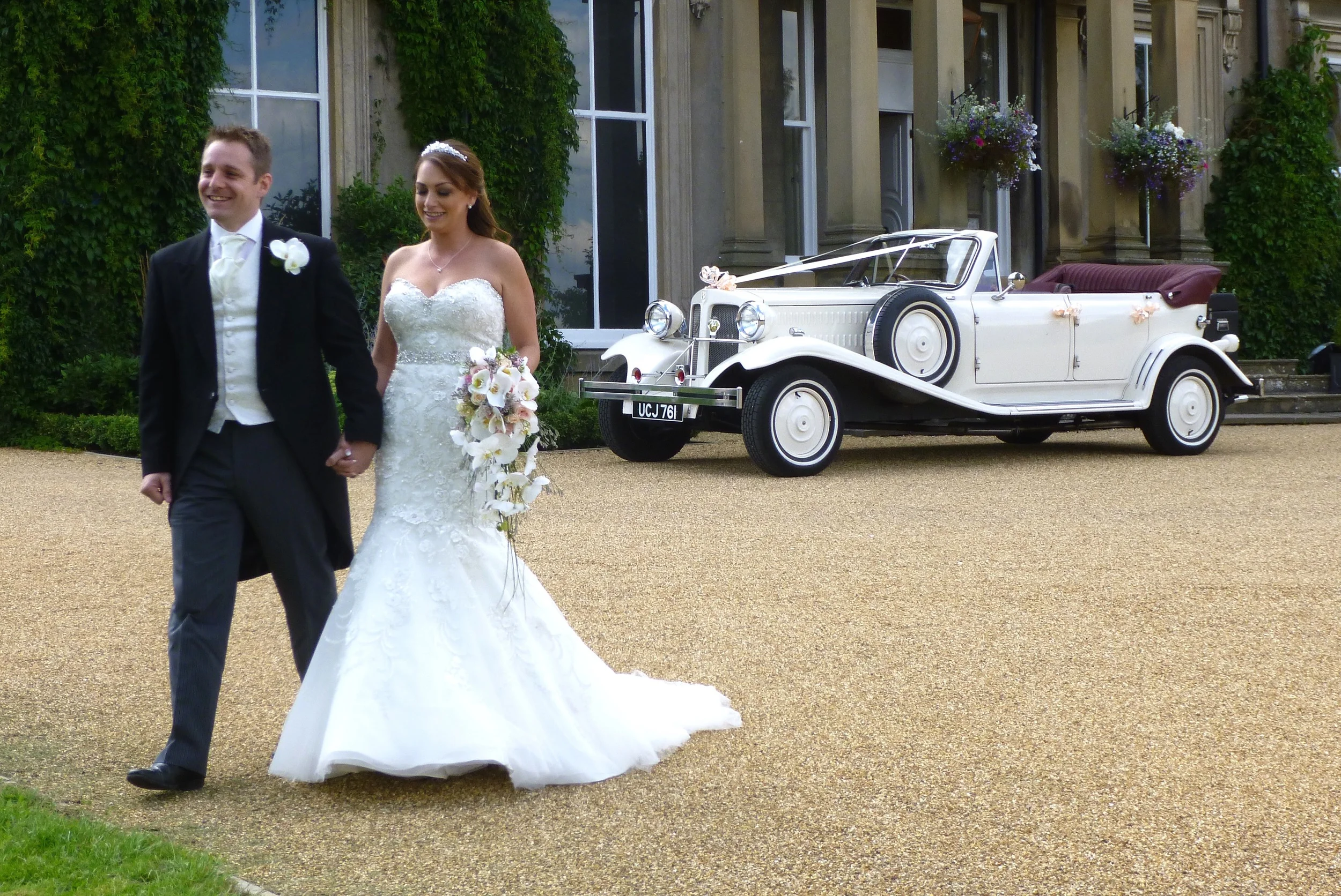 Karen and Adam happy to be married on such a lovely day and looking forward to the reception to follow at Hothorpe Hall , Theddingworth, Leicestershire.