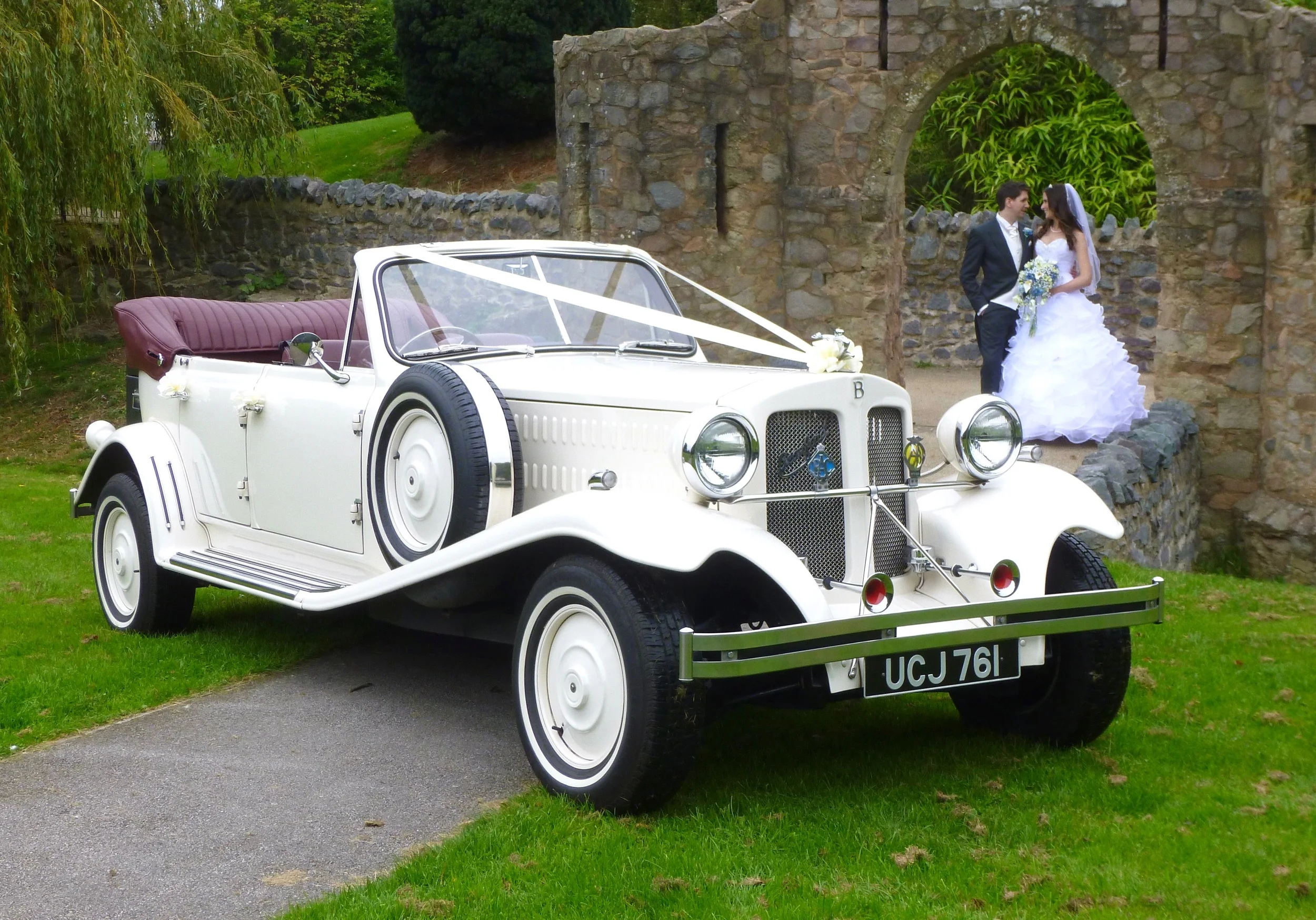 Michelle and Charlie took full advantage of the ruins of Earl Shilton Castle for a photo shoot prior to leaving for their reception at Ashton Lodge . Only a few yards with the hood down, a brief stop to pull the hood up and they were nice a warm for the journey along lanes to Street Ashton. We were greeted by the waiting guests on our "showy" arrival, again with the hood lowered. A great occasion.