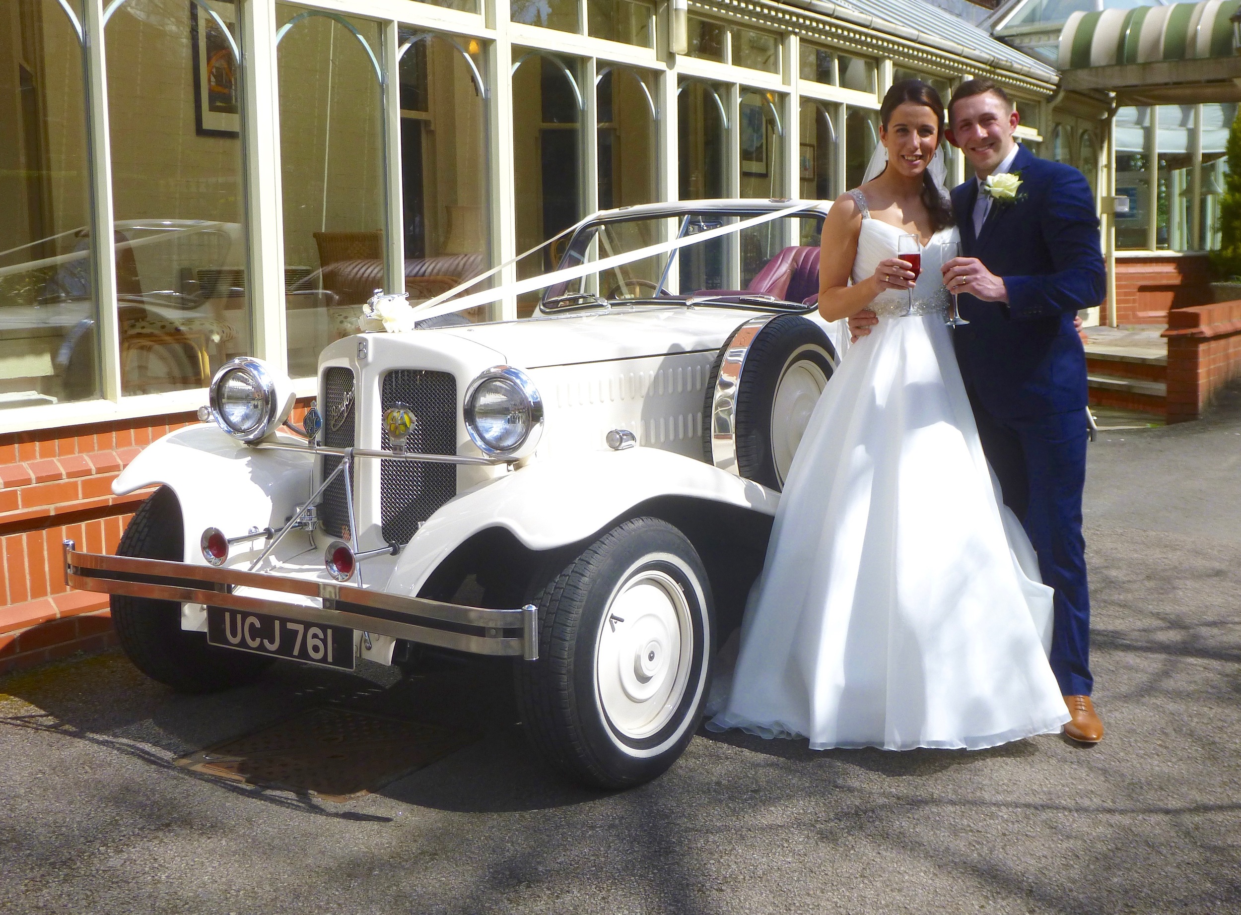 What a change from snow earlier in the day. Kimberley and Daniel enjoying a toast prior to an open top drive in the Beauford. Our best wishes to the happy couple. We really enjoyed playing a small part in the occasion.