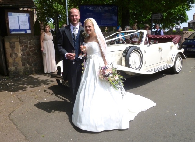 Hannah and Chris enjoying a "toast" prior to leaving for their reception at Bawdon Lodge Farm, Nanpanton. The Beauford is a lovely car with the hood down but has to be driven slowly to avoid any hair problems! On this occasion it was raised after we had driven down the High Street in Barrow upon Soar and lowered again as we approached the reception at Bawdon Lodge Farm
