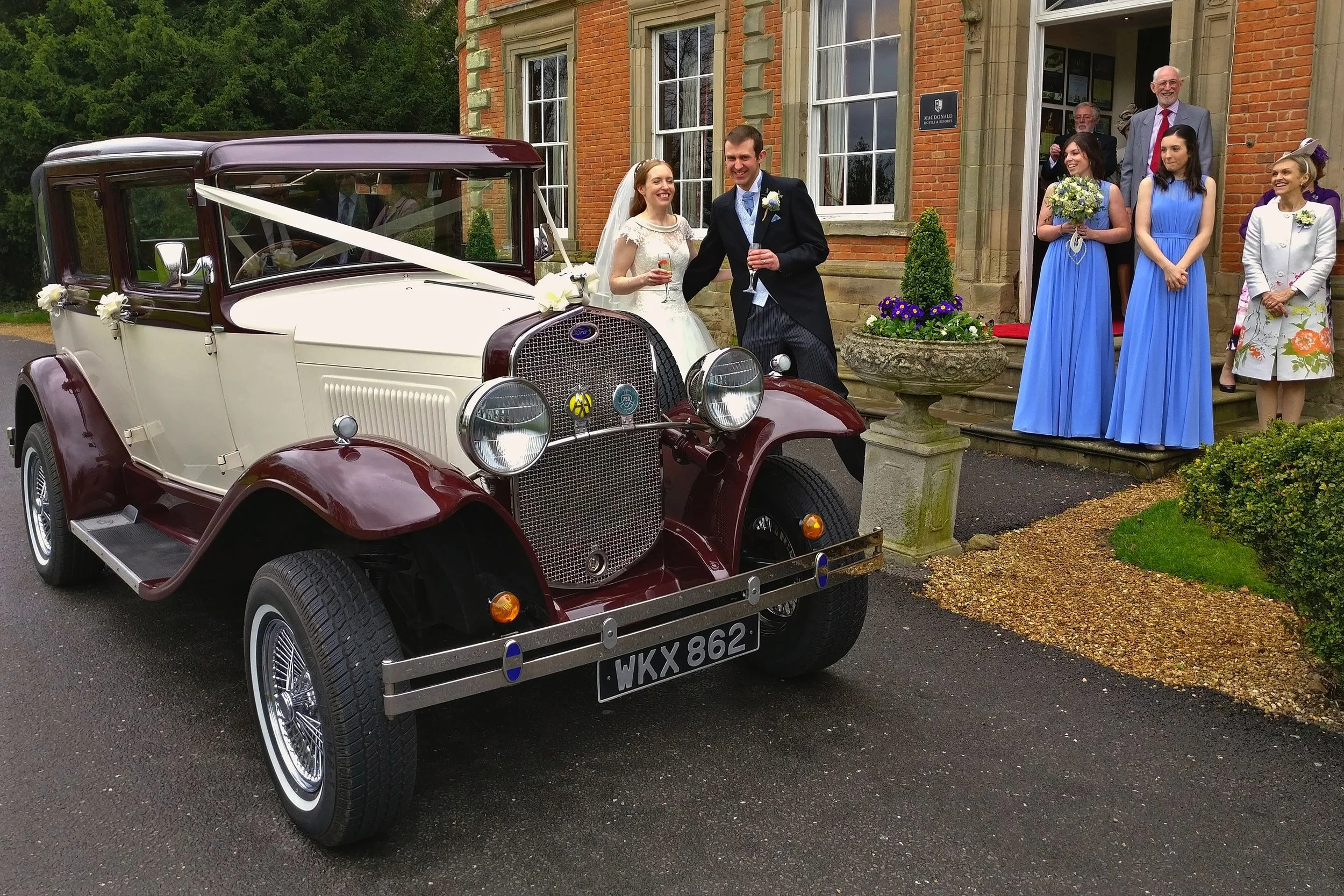 Although we experienced a little rain our arrival at Ansty Hall was dry and perfect for a photo of Tessa and Chris looking so pleased to be married!