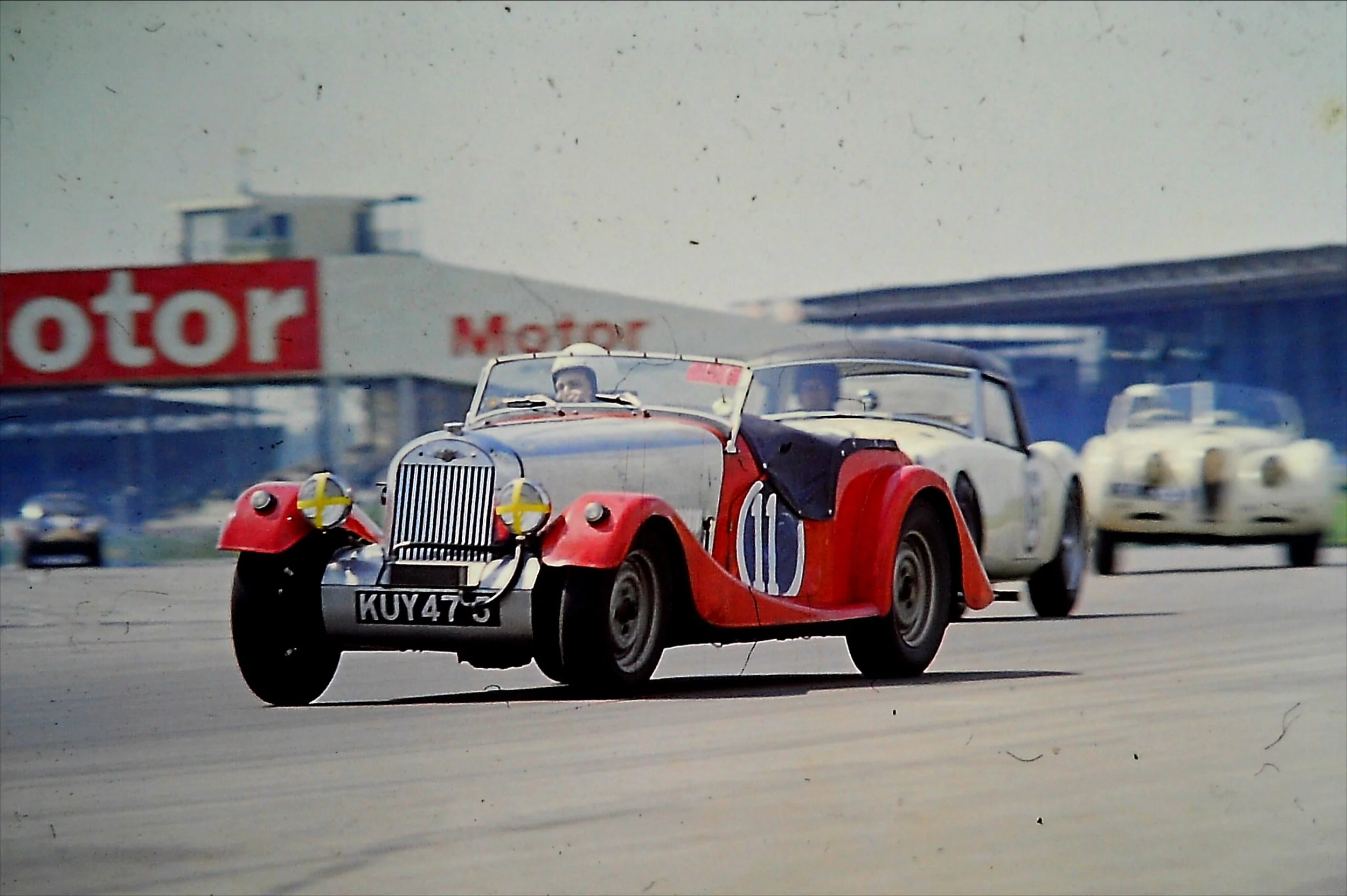 Enjoying "proper" racing at Silverstone, mid 60's.