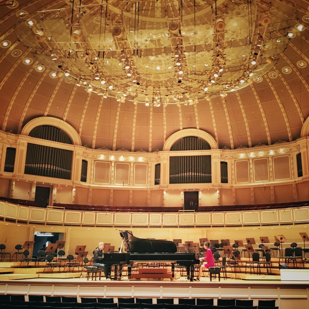 rehearsing on the storied stage of Orchestra Hall in Chicago