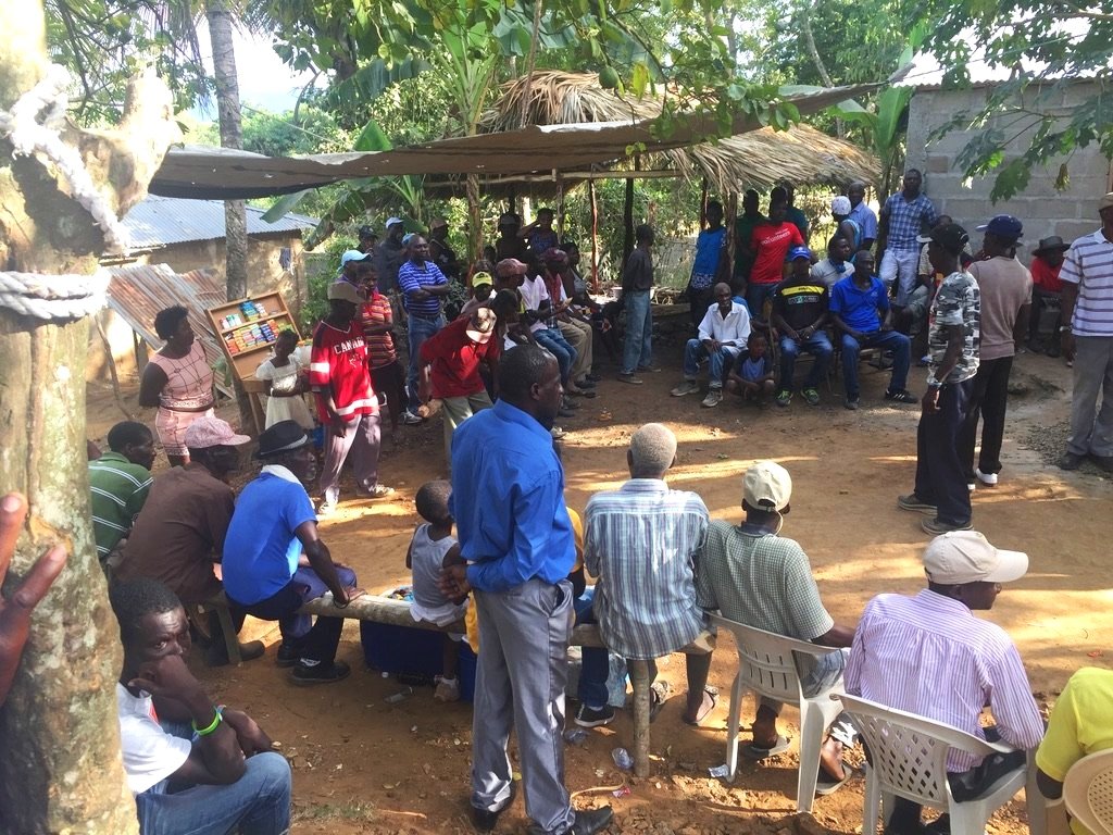 A discussion of how they should run the community's manioc mill 