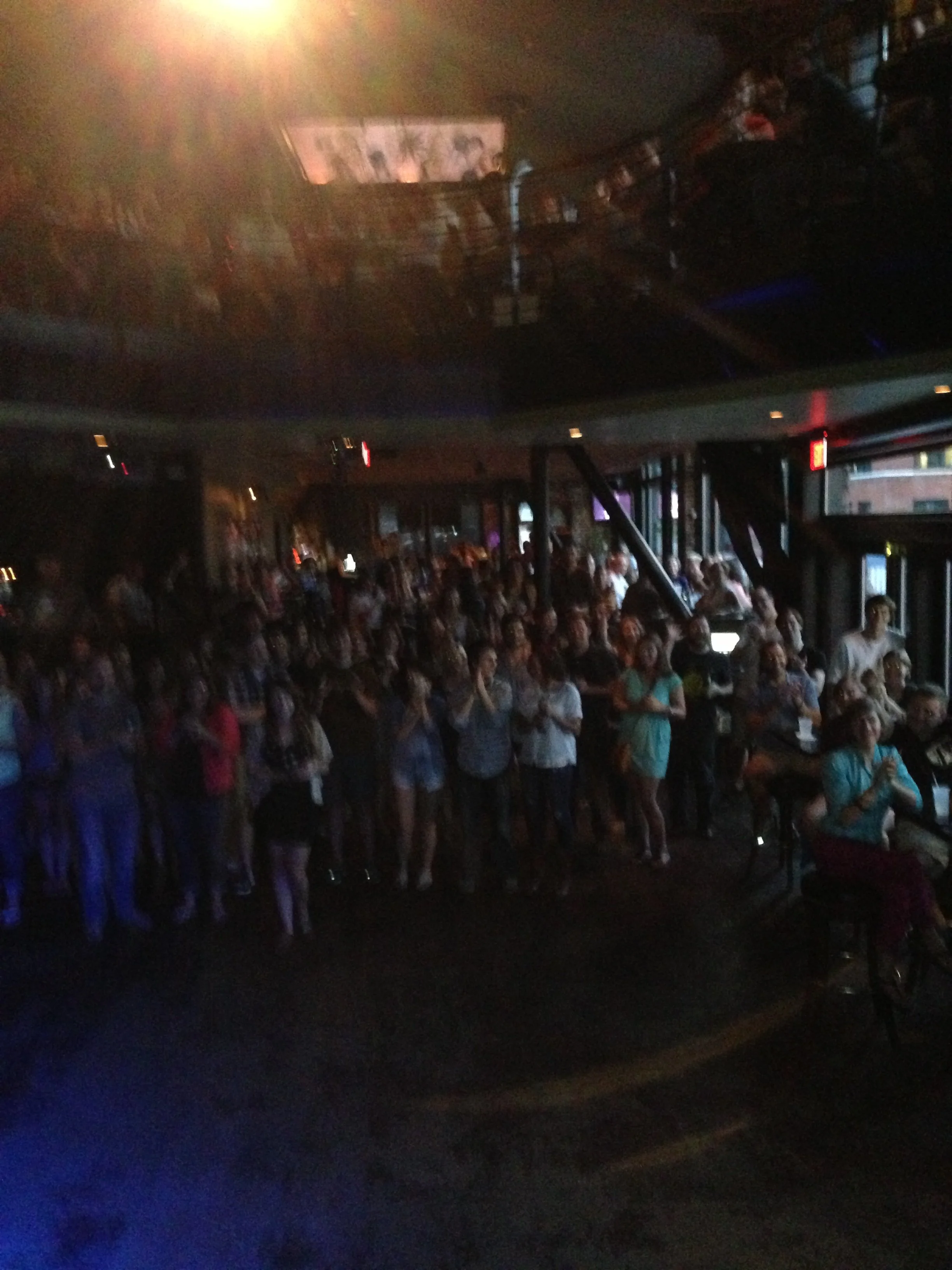 Large crowd standing across an empty dance floor at the Old Rock House during a concert.