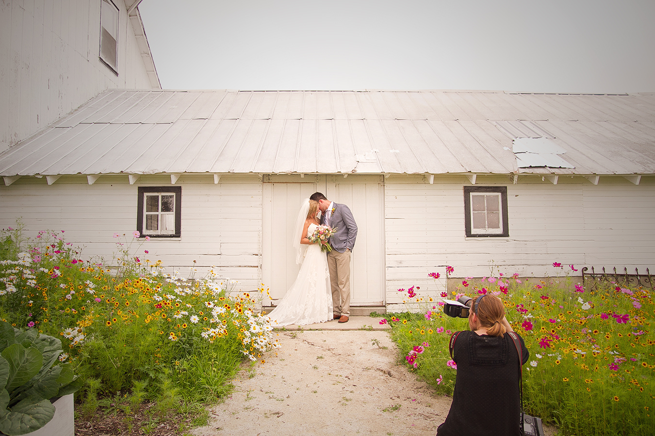 Caitlin shooting the bride and groom at Heritage Prairie Farms in Elburn, IL