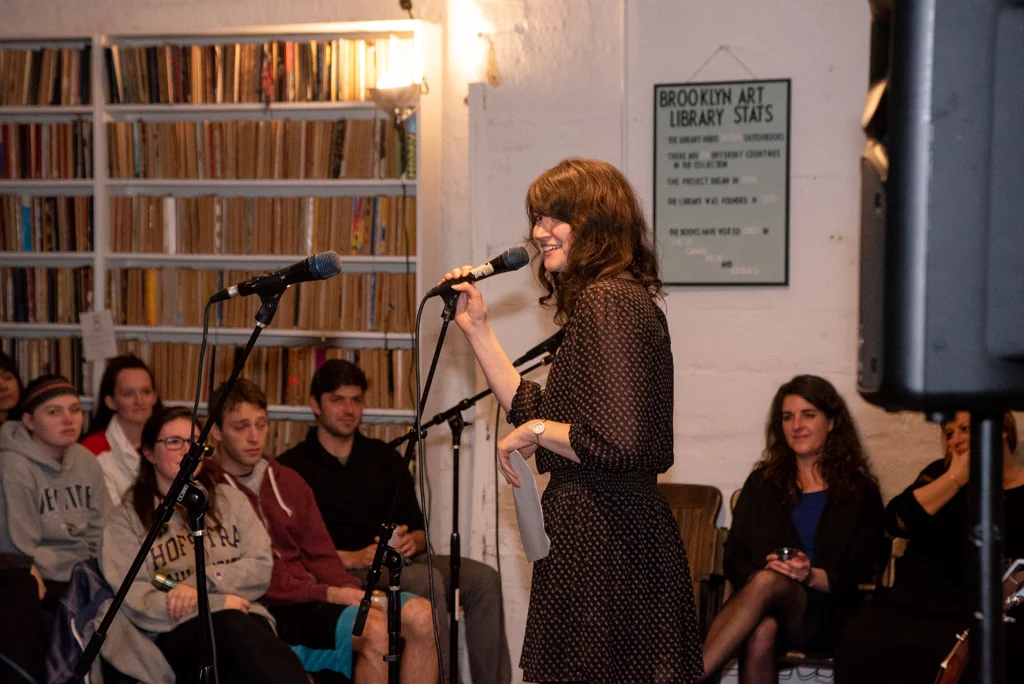 Kat reading her essay at our Burn The Book premiere on April 19. Photo by Bridget Haggerty.