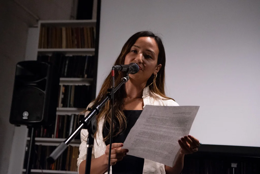 Kyle reading her essay at the Burn The Book premiere on April 19. Photo by Bridget Haggerty.